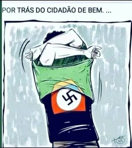 Uma pessoa retira a camisa com a  bandeira brasileira e revela por baixo o símbolo nazista