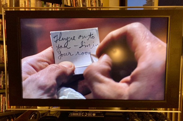 Cary Grant has written a note to Eva Marie Saint inside a matchbook inscribed with his initials ROT—“They’re on to you—I’m in your room”