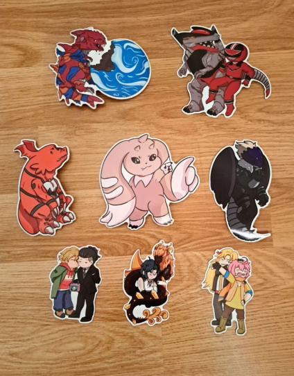 Left to right, top to bottom:
Woola from Ultraman Taiga, Vrex and TimeFire from Timeranger, Guilmon, Lopmon, Beelzemon, Buddy Daddies Kazuki kissing Rei's cheek, Genshin Morax wrapped around Xiao, Beyblade Burst Akira posing in front of Zac