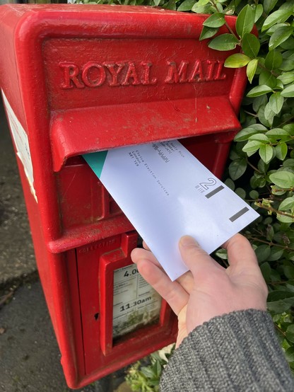 Strike ballot being slid into a post-box