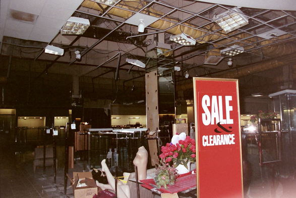 Inside a Robinson’s May department store with a collapsed false ceiling, and a no-longer-needed “sale & clearance sign at the Northridge Fashion Center, by the epicenter of the January 17, 1994 Northridge earthquake