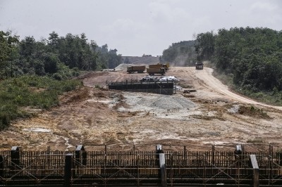 Several lorries at the construction site of the East Coast Rail Link project. / Photo from linked article.