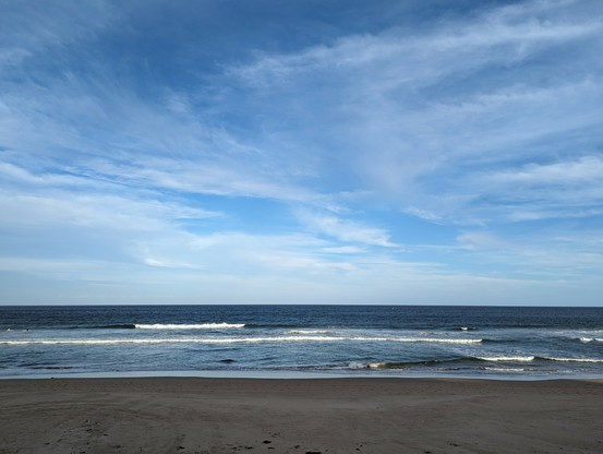 My favourite place the open ocean seen across a broad beach with the tides rolling in