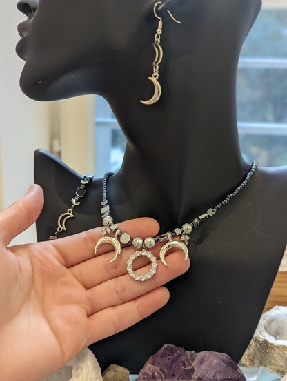 Round zircon and silver moon set with zircon leaves, silver moon beaded bracelet and silver moons earrings
