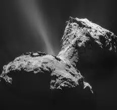 The nucleus of the comet, like two rough-surfaced potatoes stuck together, with a thin jet of material emerging from the central region
