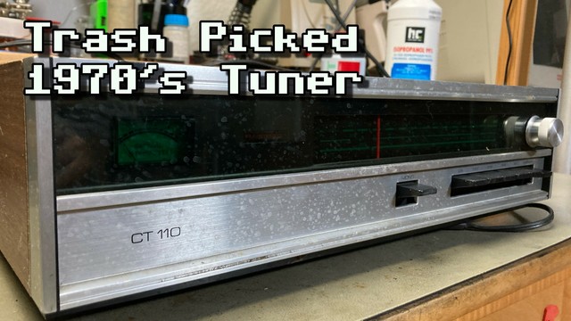 Thumbnail for my video. A Dual CT-110 vintage tuner on my workbench that looks slightly dirty. It has a brushed aluminum(i)um front panel with a dark frequency scale that appears to be lit green when powered.