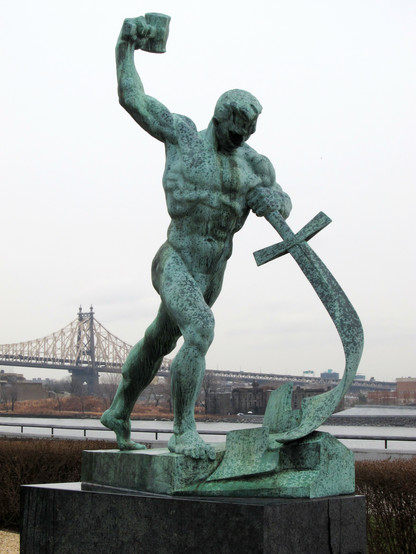 Let Us Beat Swords into Plowshares, a sculpture by Evgeniy Vuchetich in the United Nations Art Collection. Shows a burly man swinging a hammer into a sword. By Neptuul - Own work, CC BY-SA 3.0, https://commons.wikimedia.org/w/index.php?curid=32412758