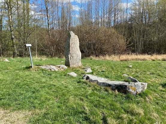 An even wider shot of the runestone from a left angle.