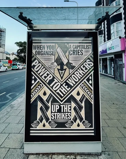 When you Organise 
A Capitalist Cries

POWER TO THE WORKERS
UP THE STRIKES 

Art illustration by Frank Riot poster size put into a bus shelter “advertising” space (behind glass) on a suburban street. 

https://www.frankriot.co.uk/about-3