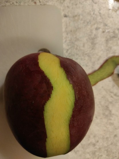 Mango with one peel looking like pixels