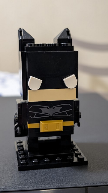 Closeup portrait of Lego Batman Brickheadz figure in design from the Christopher Nolan movie trilogy.