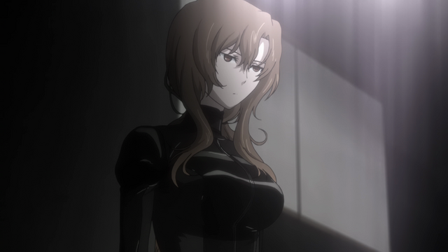 A woman (Moeka) in a tight body suit with a non-emotional expression on her face.
