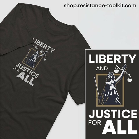 A black T-shirt featuring a design of Lady Justice holding a sword and scales, enclosed in a gold frame. Above and below the illustration, the words 'LIBERTY AND JUSTICE FOR ALL' are written in bold white and gold letters. The design is also displayed separately in a close-up beside the shirt.