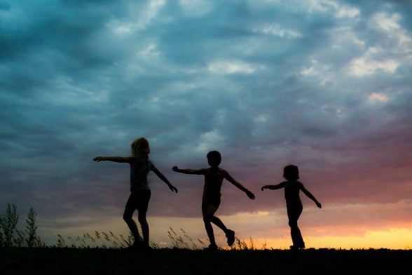 Silhouette of children playing