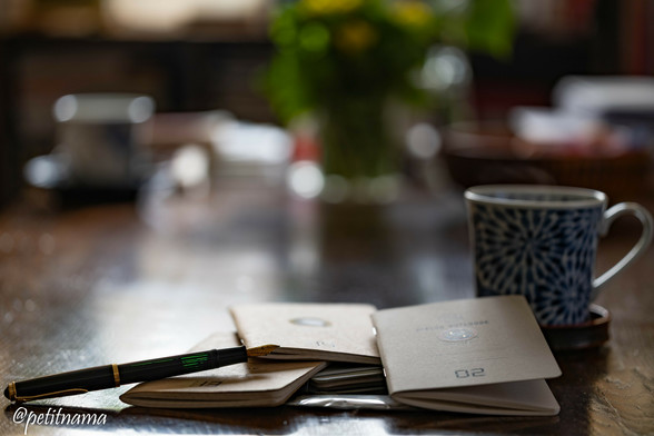 Fountain pen and four Dialog notebooks and a cup of coffee