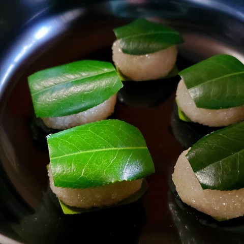 Tsubaki-mochi are rice cakes adorned with camellia leaves.