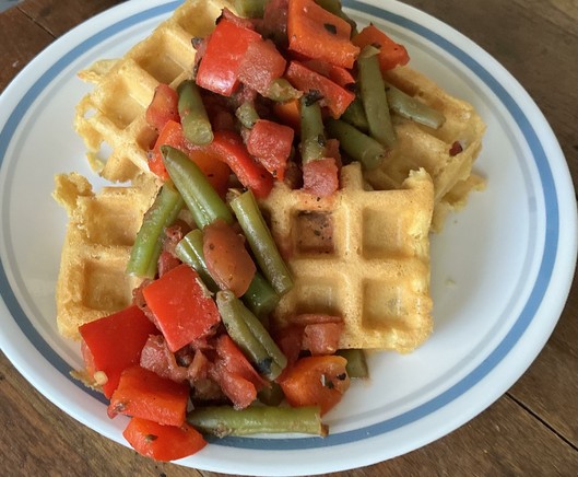 Savory chickpea waffles with topping of green beans, red bell peppers, and tomatoes. Looks tasty!