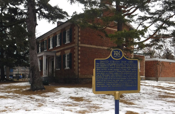 DAVID GIBSON 1804-1864
This building, a good example of an early Victorian farm-house, was completed in 1851 by David Gibson. Born in Glamis Parish, Forfarshire, Scotland, Gibson emigrated to Upper Canada where, in 1825, he was appointed a Deputy Land Surveyor. He was an ardent supporter of William Lyon Mackenzie, and was twice elected as a Reform member to the provincial parliament. One of Mackenzie's chief lieutenants in the unsuccessful Rebellion of 1837, he fled to the United States. His house was burned by order of the Lieutenant-Governor, Sir Francis Bond Head, and his property was made subject to forfeiture. Fully pardoned, he returned in 1848, and resumed his profession as surveyor.  Later he was appointed as Inspector of Crown Land Agencies and Superintendent of Colonization Roads.