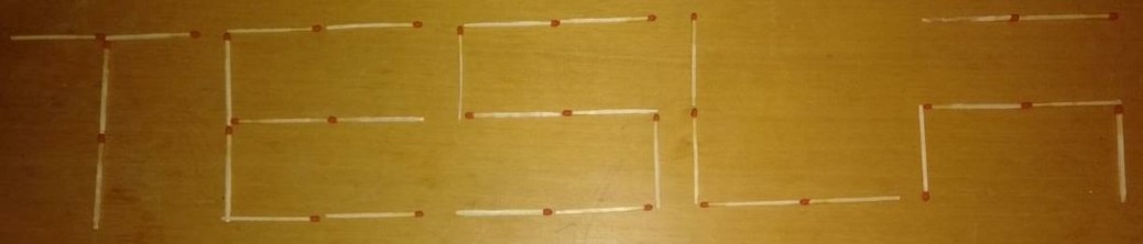 "TESLA" brand name written with matchsticks