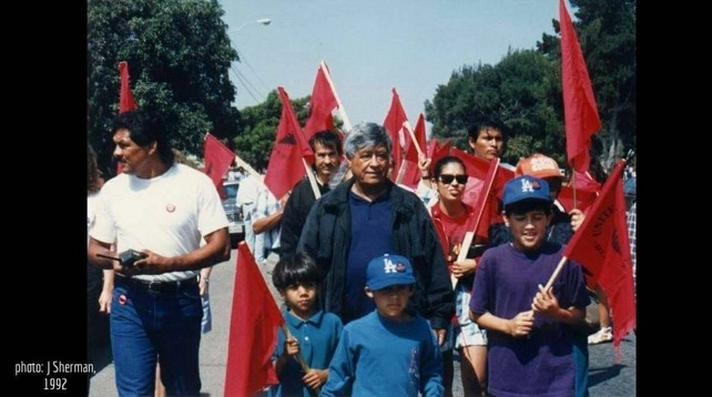 Historical picture of Cesar Chavez in a march with his grandchildren. Photo by Jocelyn Sherman