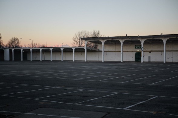 An empty parking lot at dusk.