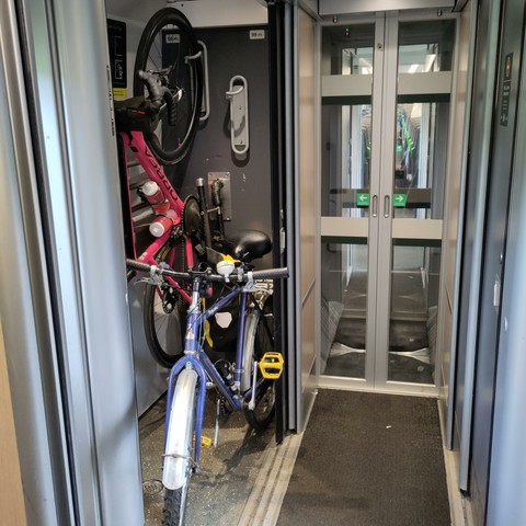 The bike storage locker, which already has one bike stood upright in it and mine sitting next to it, sticking out andblocking the corridor, because I can't hang it