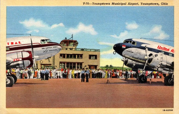 We see nose to nose a United Airlines DC3 on the right and a Pennsylvania Central DC-3 on the left.