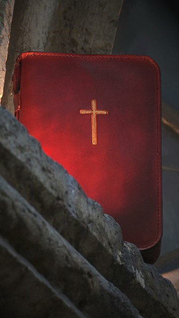 Photo shows the leather covers from front. There is a hand carved cross on the front cover. Cross is painted in gold and it looks very beautiful on these mahogany color leather covers.