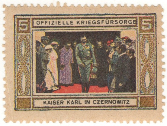 stamp
tan paper, rectangular frame with elongated wreaths and the denomination, "5," in the two vertical borders.
in the horizontal borders:
Offizielle Kriegsfürsorge Kaiser Karl in Czernowitz

the scene in the center depicts him in blue uniform walking on a red carpet as he leaves leaving a reception of dignitaries