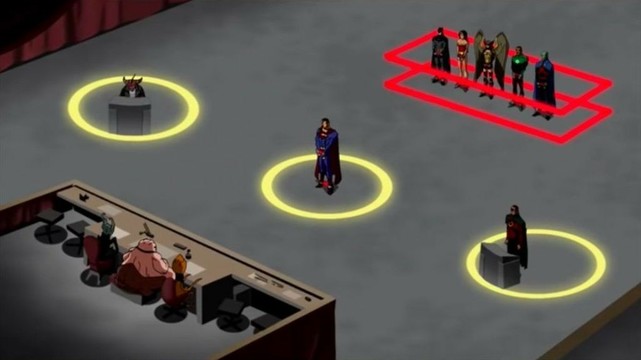 A far-away shot showing a group of people standing in a glowing box, handcuffed. They are flanked by two figures at podiums, and are facing a panel of three judges. Superman stands in the center.