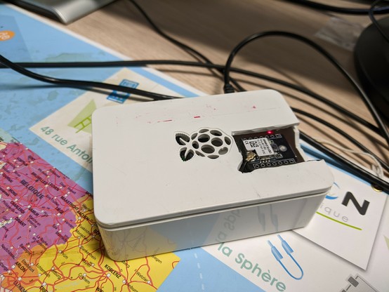 a xiao-s3 module hooked to a raspberry pi inside its box ...