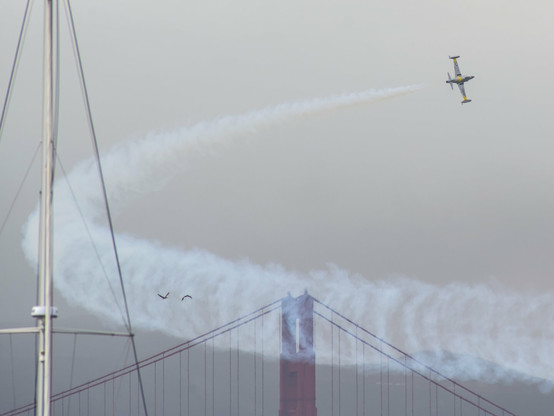 Ace Maker - T-33 doing a fly by and turn with the golden gate bridge in the background
