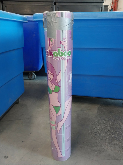 A collapsible stripper pole that's been duct taped back into its tube