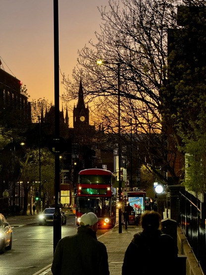 The clock tower at St Pancras Int'l Station in the distance as the sun sets.