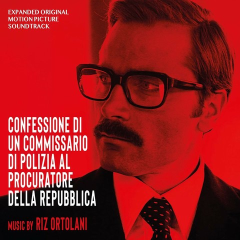 Ein monochromes rotes Soundtrack-Cover zeigt Kopf und rechte Schulter eines eleganten Mannes mittleren Alters mit Hornbrille und Schnäuzer. Sein Blink geht zum linken Bildrand. Text in der linken Bildhälfte: Oben klein "Expanded original motion picture soundtrack", in der unteren Hälfte groß "Confessione di un commissario di polizia al procuratore della repubblica" und "Music by Riz Ortolani".