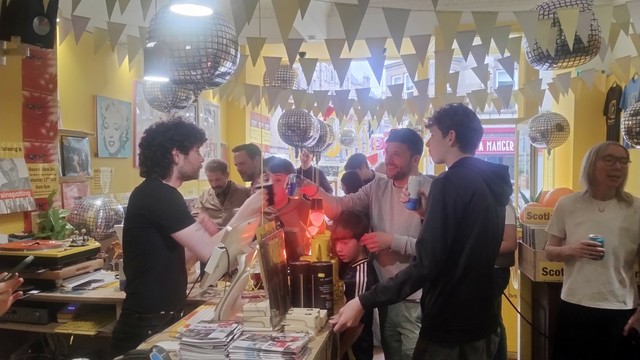 Looking through Indie record store, Thorne Records, as it is still busy with people celebrating Record Store Day even as it moves into evening