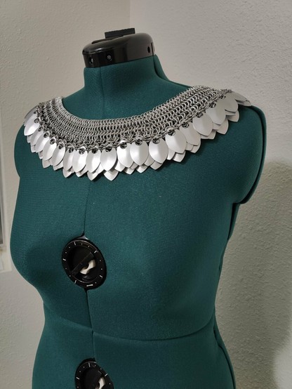 An angled front view of the chainmail described in the post. It is modeled on a mannequin with a plain background.