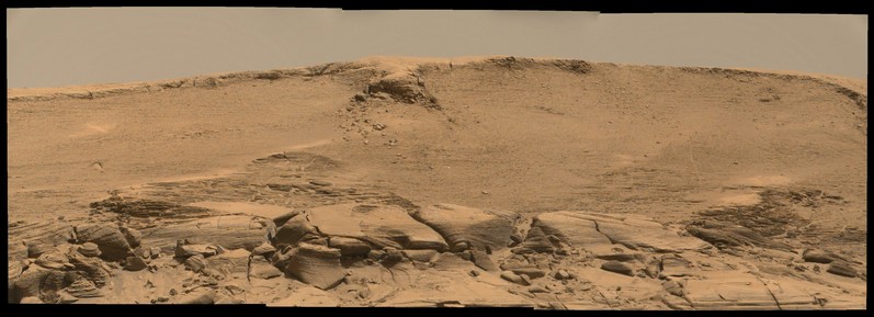 An ochre toned mosaic of three images capturing a Martian landscape