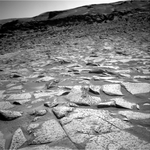 A black and white image capturing a Martian landscape