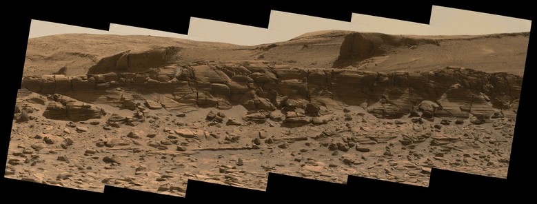 An ochre toned mosaic of twelve images capturing a Martian landscape
