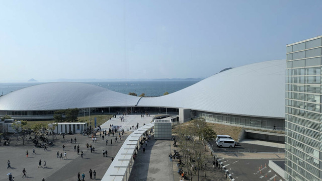 The Kagawa Arena seen from Sunport Hall building with the Seto Inland Sea in the background.