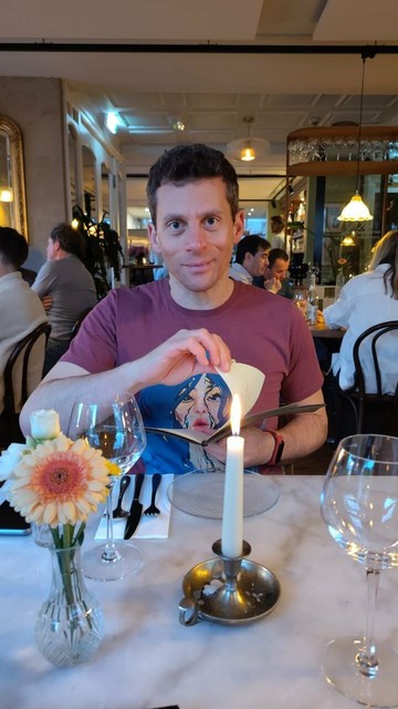 picture of me sitting at a restaurant table