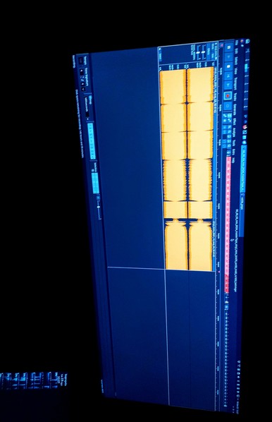 The photograph composed in pitch black darkness shows an IPS LED panel displaying a digital audio workstation (DAW) interface. The screen is predominantly dark blue, with a horizontal timeline on the left side, indicating the audio's duration. The central area features a grid with yellow blocks, representing audio clips or regions, arranged in a horizontal stack. The top of the screen includes various controls and buttons, such as "Record," "Time Signature," and "MIDI," along with a red record button. The right side of the screen has additional controls, including "Edit," "View," and "Transport," with a ruler and other editing tools visible. The interface is detailed, with text labels and numerical values, suggesting a professional audio editing environment. The background is dark grey, emphasizing the screen's content.

 Ovis2-8B

🌱 Energy used: 0.188 Wh