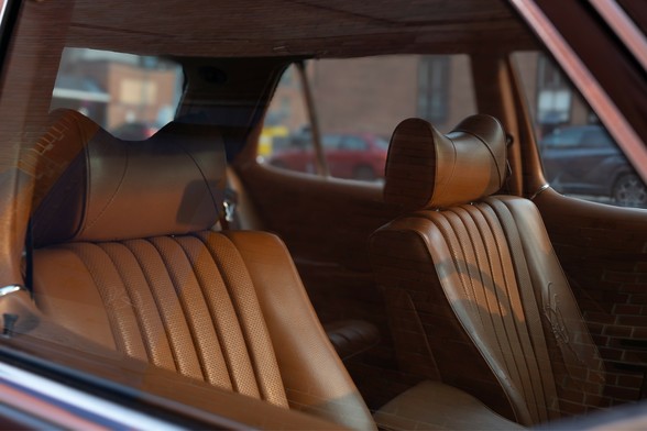 The distinct interior of an 80’s Mercedes backing in the sun.