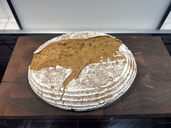 A loaf of khorasan bread on a cutting board.