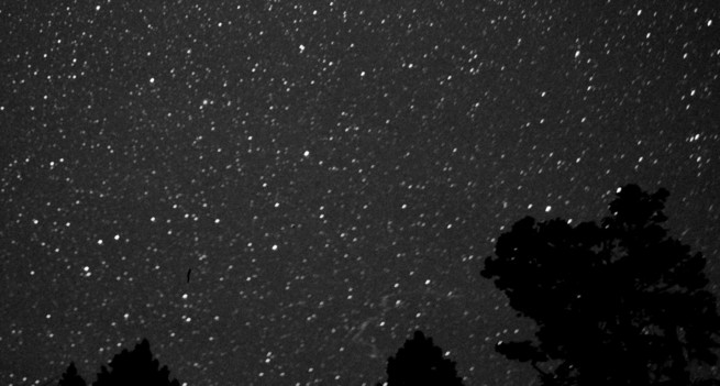 The meteor trail is still faintly visible after five minutes. It's a squiggly line, distorted by very high altitude winds.