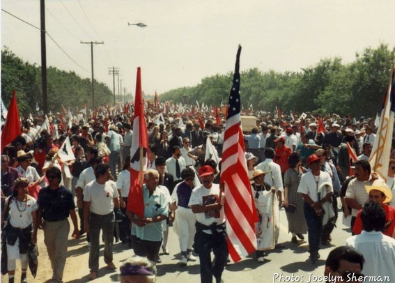 Photo of Cesar Chavez's funeral procession with thousands of people