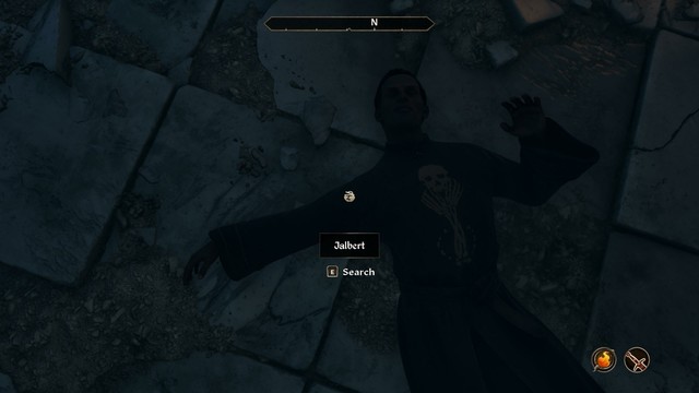 The necromancer, Jalbert, lies dead, he's wearing necromancers robes, a tunic showing a skull logo held up by two skeletal hands and a circle of bones at the base. Don't get back up Jalbert.