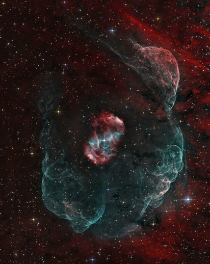Explanation: Beautiful emission nebula NGC 6164 was created by a rare, hot, luminous O-type star, some 40 times as massive as the Sun. Seen at the center of the cosmic cloud, the star is a mere 3 to 4 million years old. In another three to four million years the massive star will end its life in a supernova explosion. Spanning around 4 light-years, the nebula itself has a bipolar symmetry. That makes it similar in appearance to more common and familiar planetary nebulae - the gaseous shrouds surrounding dying sun-like stars. Also like many planetary nebulae, NGC 6164 has been found to have an extensive, faint halo, revealed in this deep image of the region. Expanding into the surrounding interstellar medium, the material in the halo is likely from an earlier active phase of the O star. This gorgeous telescopic view is a composite of extensive narrow-band image data, highlighting glowing atomic hydrogen gas in red and oxygen in greenish hues, with broad-band data for the surrounding starfield. Also known as the Dragon's Egg nebula, NGC 6164 is 4,200 light-years away in the right-angled southern constellation of Norma.