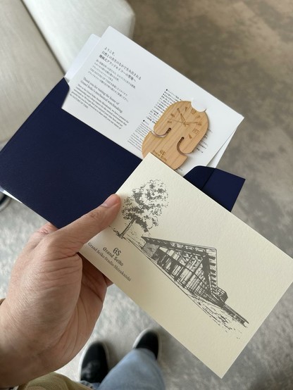 Parting gifts for every visitor: small letter, postal card and a wooden engraving of a GS dial.